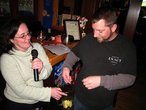 Lorraine (Bev Place Beer Goddess) helps Marcus pick the winner of the bike, just one of the prizes they raffled off last night.